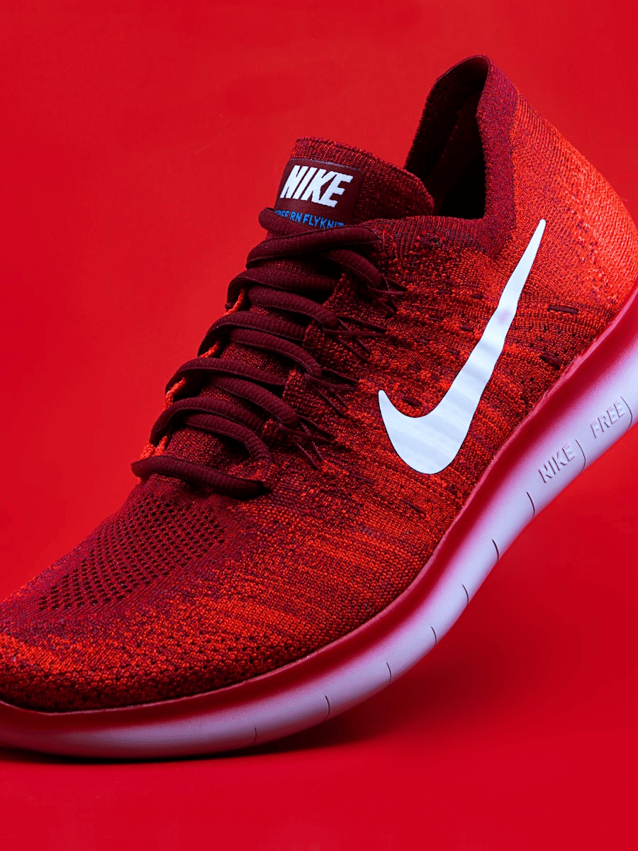 Red sneaker product shot on a bright backdrop