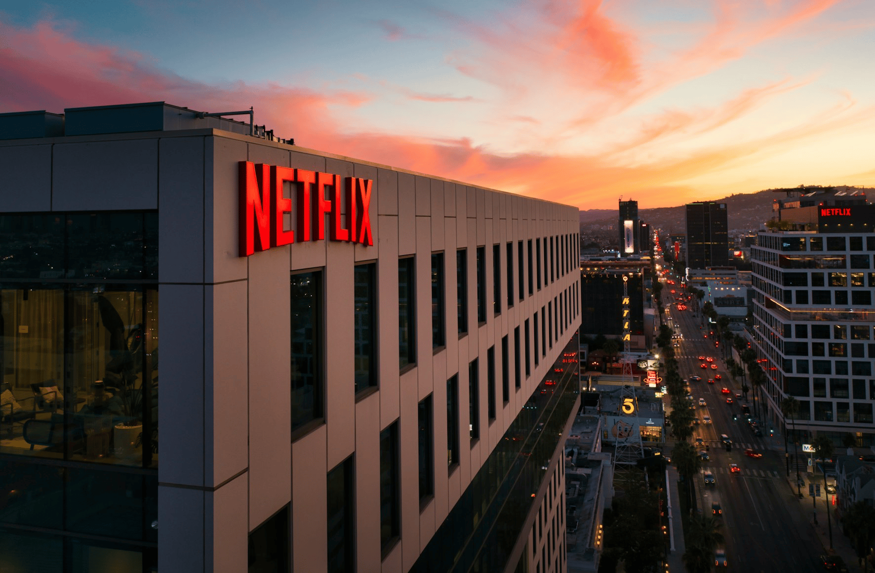 Netflix office building overlooking a city street at sunset